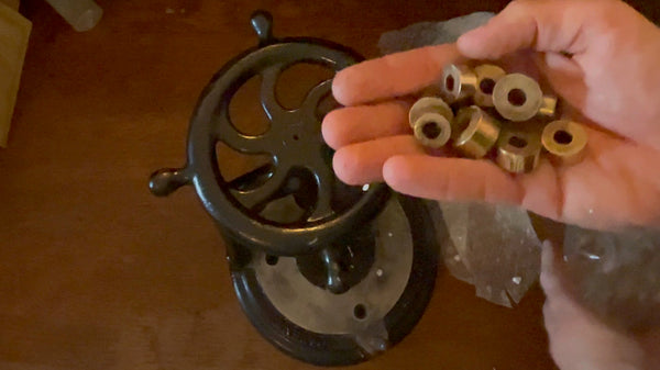 Close-up of the multiple brass dies that come with the Pinfold's machine