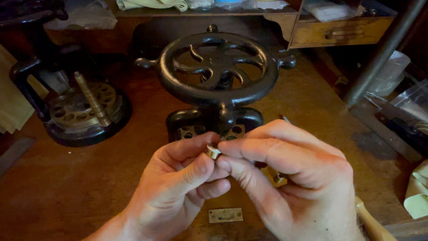 Evaluating the ring's fit on the subsequent larger die