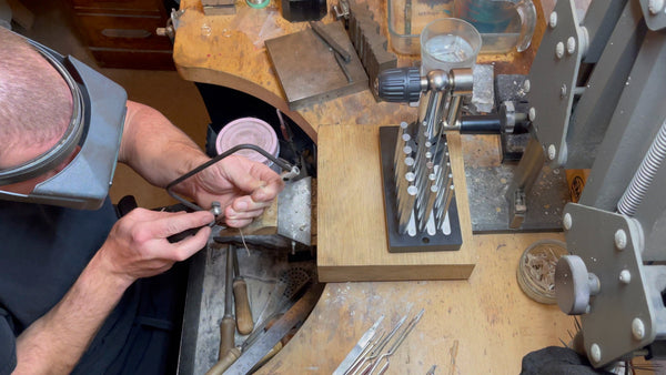 jeweller sawing jump rings