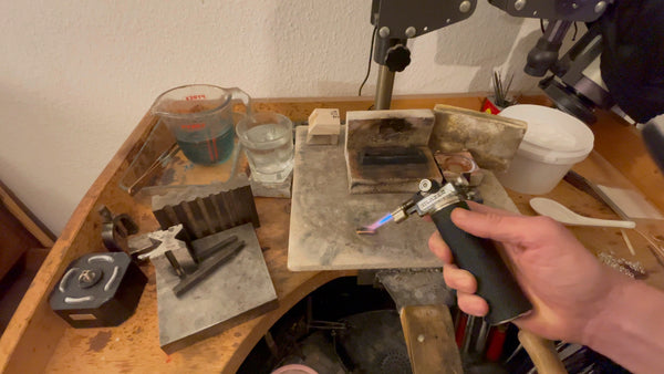 Gold ingot undergoing the annealing process, rekindled flame enhancing strength.