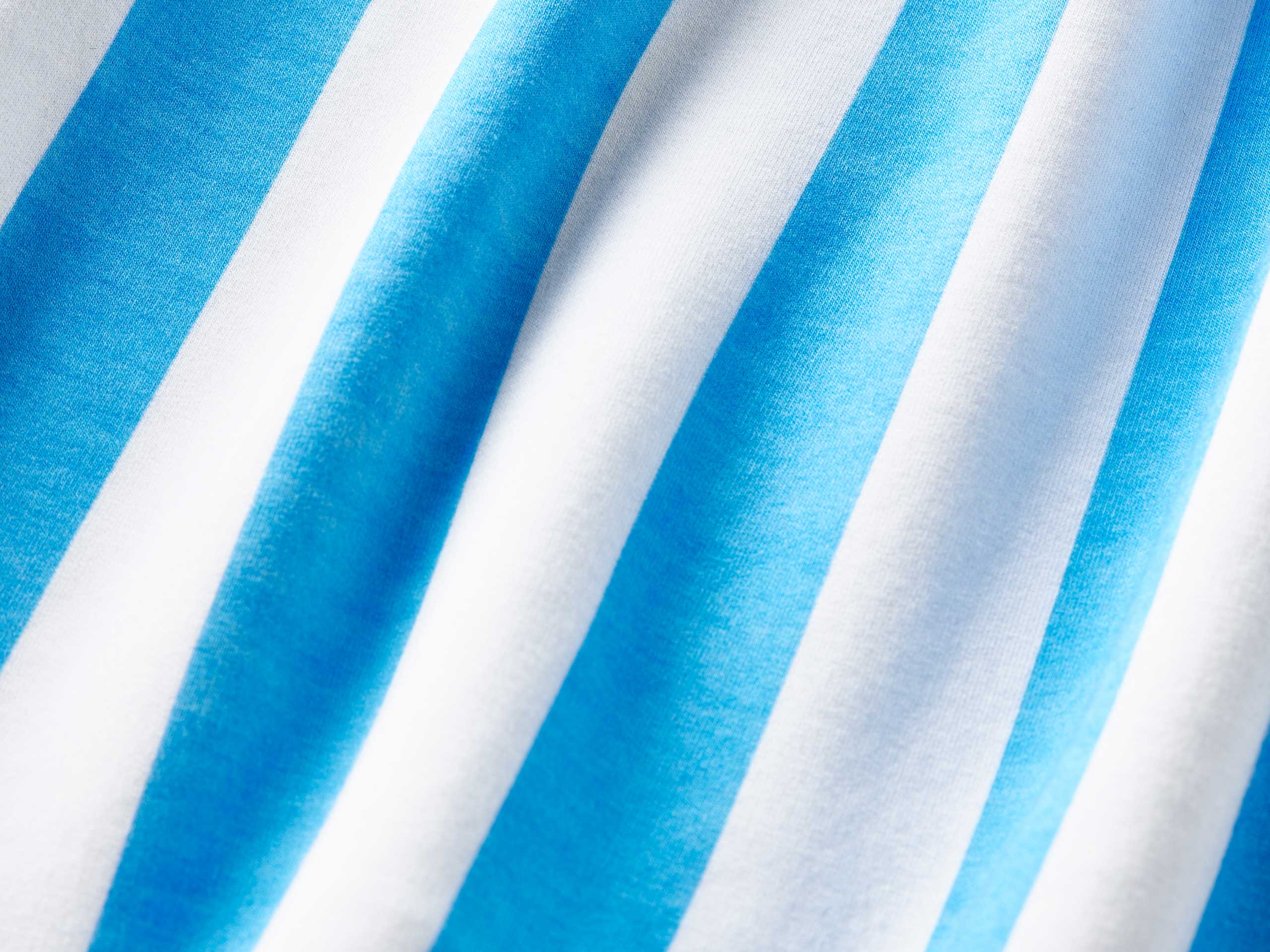 Close up detail shot of blue and white cabana stripe.