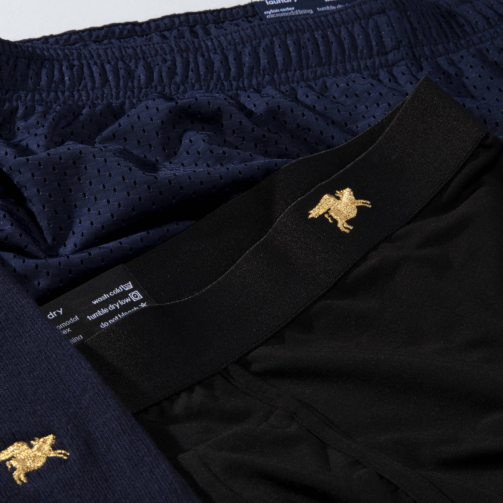 Lounge shorts and socks with flying pig icon embroidery.