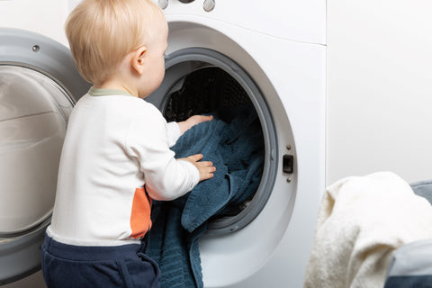 toddler doing laundry a starter chores for kids