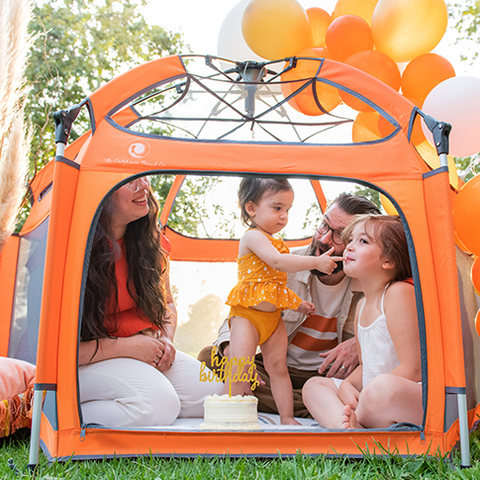 pop n' go playpen with family at the park