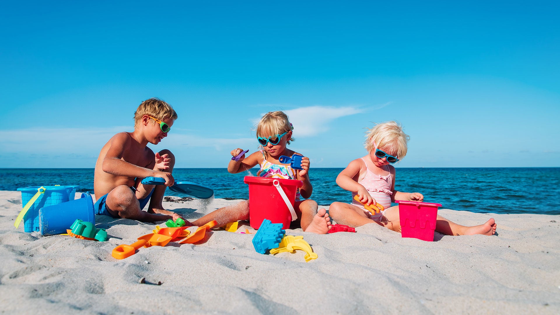 toddlers playing on beach