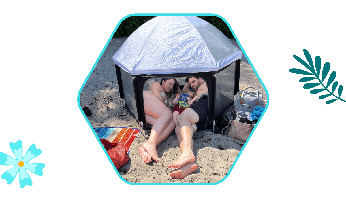 family enjoying beach day in pop 'n go playpen