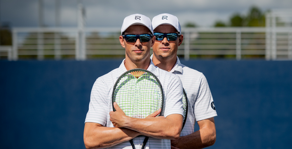 Bob and Mike Bryan Wearing RIA Eyewear Holding Tennis Racquets In Florida