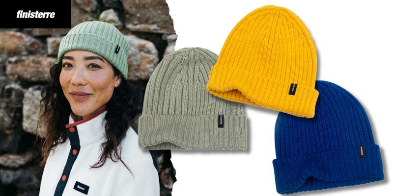 A smiling woman wearing a Finisterre beanie, with 3 still-life shots of beanies.