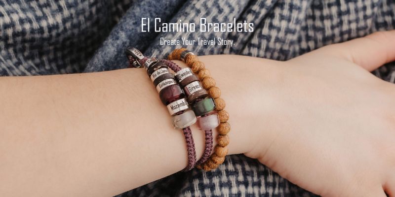 A woman's hand wearing a Double El Camino Bracelet in Purple, showing the Countries and Regions that she’s travelled to.