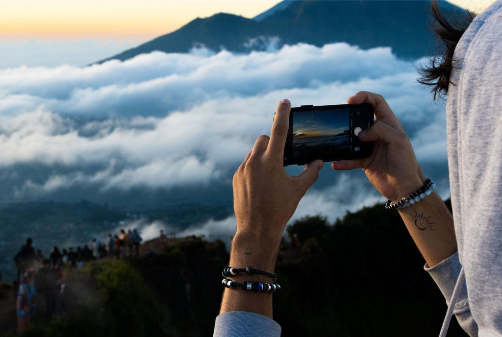 Jason wearing an El Camino Bracelet, photographing Mount Batur in Bali, Indonesia.