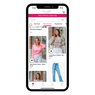 Photo of a phone showing the Tuscaloosa boutique, Ivy House Boutique app