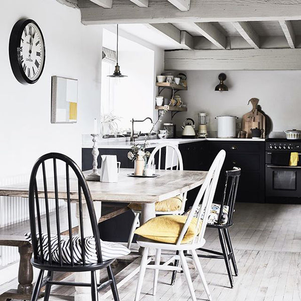 Industrial style lights in coastal inspired kitchen