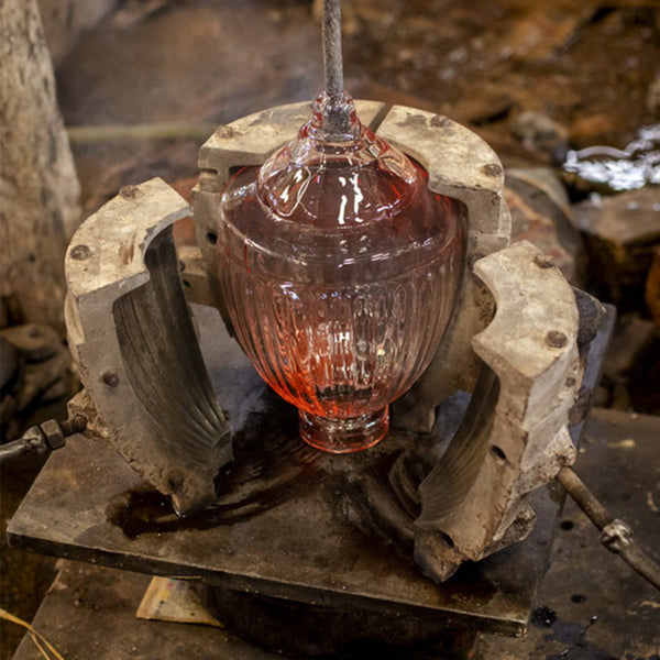 Handcrafted glass light in production