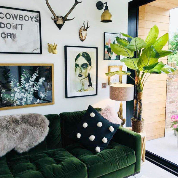 Living room interior with green velvet sofa