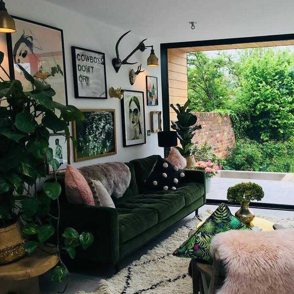 Living room interior with wall art and brass lights