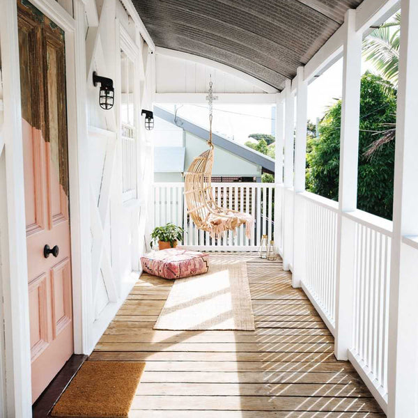 Pink styled balcony with industrial outside light