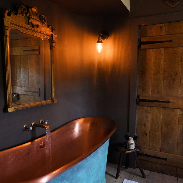 Bath in hotel room interior with retro light