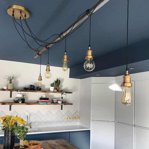 dark kitchen with hanging kitchen lights