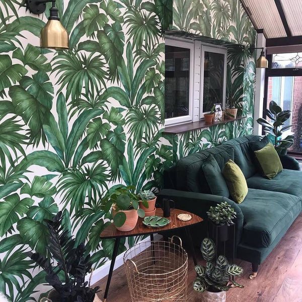 Green leaf wallpaper in a green living room