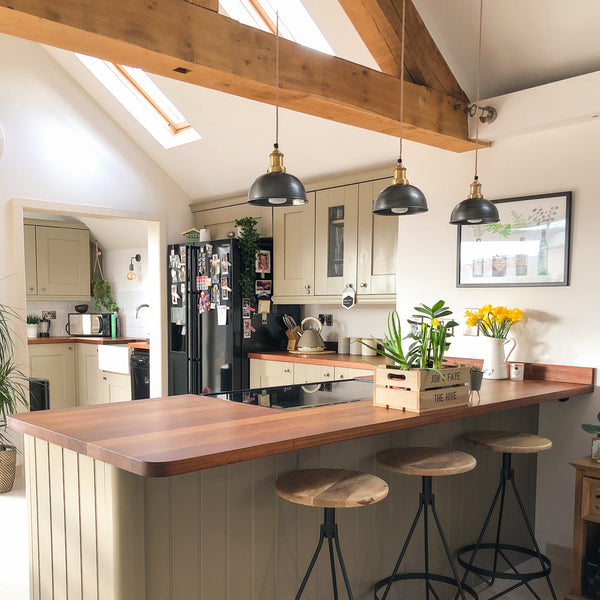 Small pewter dome kitchen pendant lights in a rustic-style kitchen