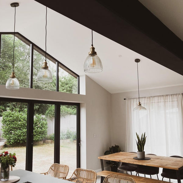 Glass pendant lights in a kitchen-dining area