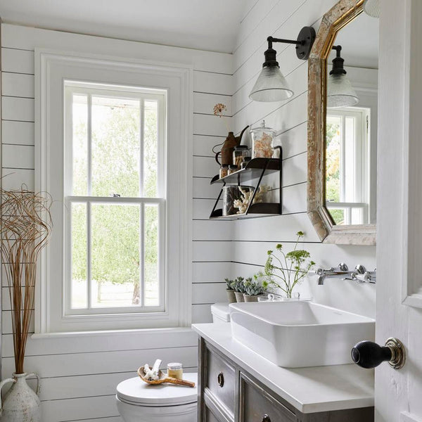 A white farmhouse-style bathroom
