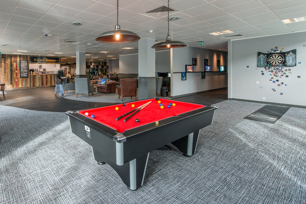 Pool table in office with retro lighting