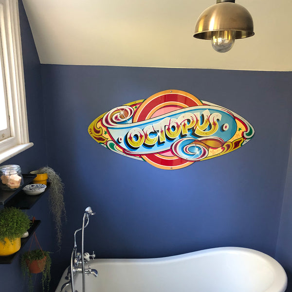 Bathroom with themed decal on the back wall