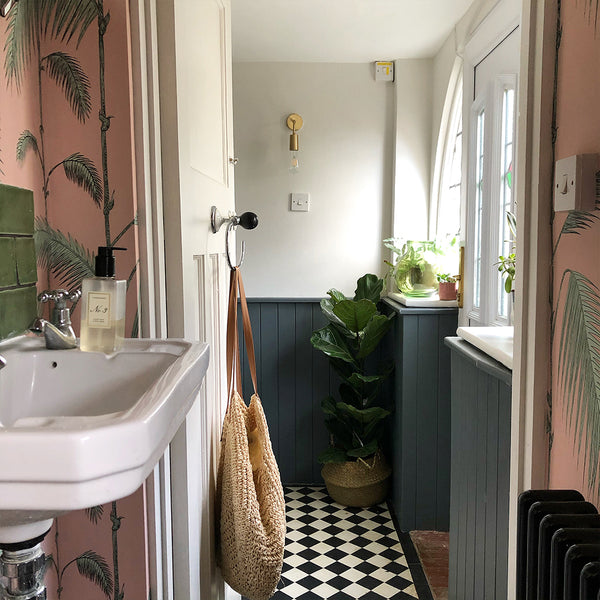 An elegant bathroom featuring industrial style lights