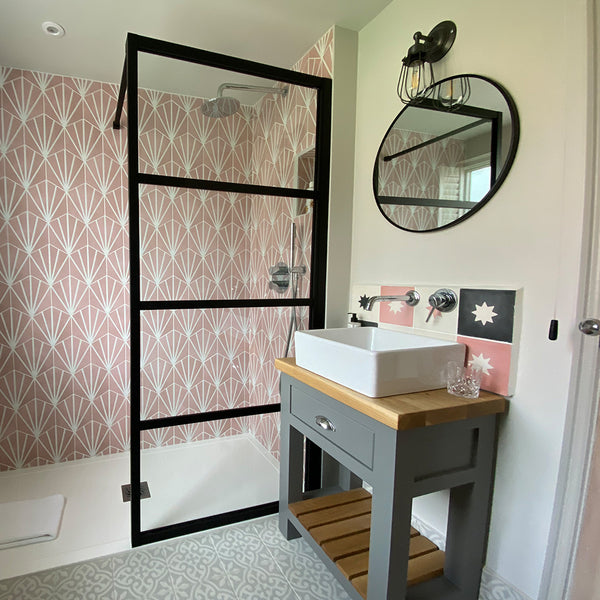 Bathroom with colourful back splash in shower