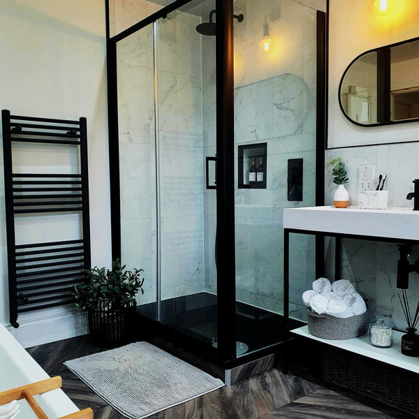 A sleek, modern bathroom with black accents