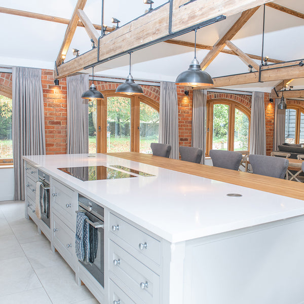 residential designed kitchen with hanging light fixtures