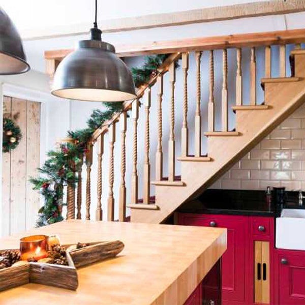 Pewter lights hanging over kitchen island with star decoration