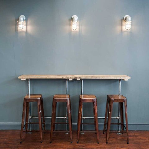 A simple wall table and industrial stools