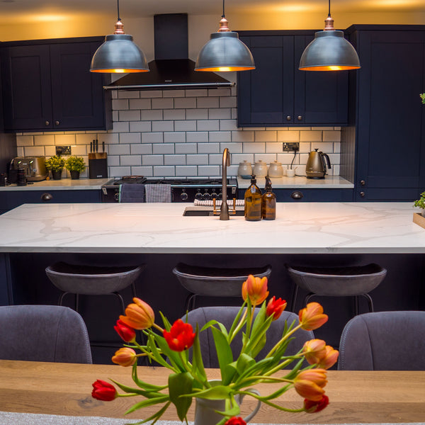 three pendants over a kitchen island