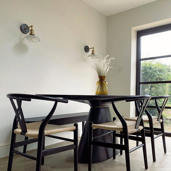 A sleek black dining table and chairs
