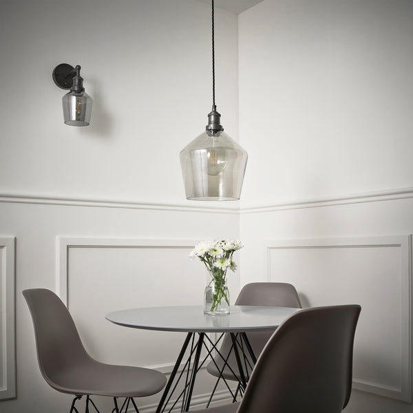 Smoke grey tinted glass shades around a dining table