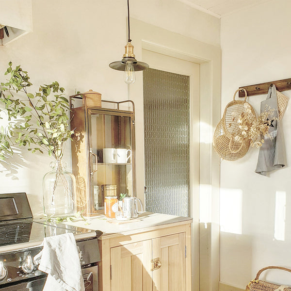 Kitchen side dresser with hanging ceiling light