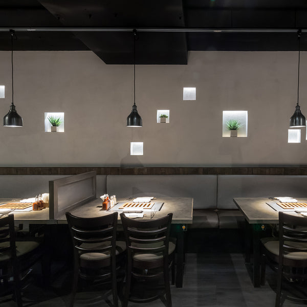 A modern industrial restaurant interior in grey