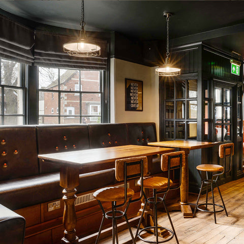 A large pub interior with wooden furnishings