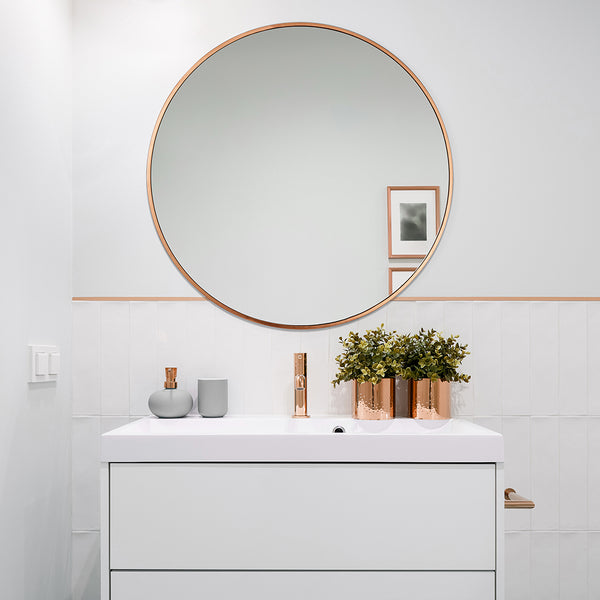 A minimalist bathroom interior with statement mirror