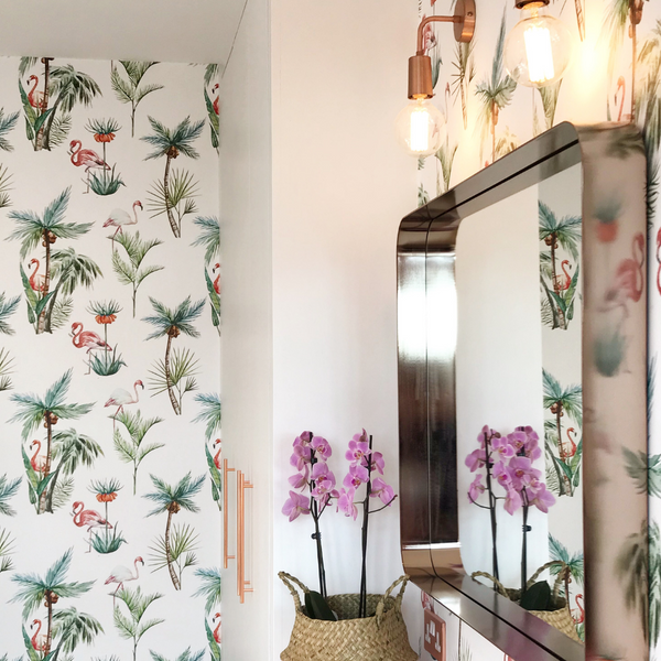 A tropical wallpaper with a statement mirror