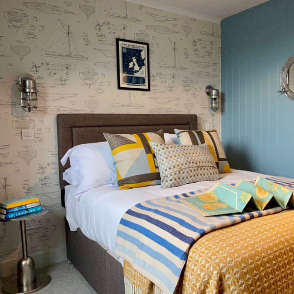 A yellow and blue nautical themed room