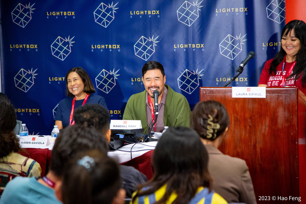 Korean American actor Randall Park at the CAPE x Lightbox Comic Panel answering questions.