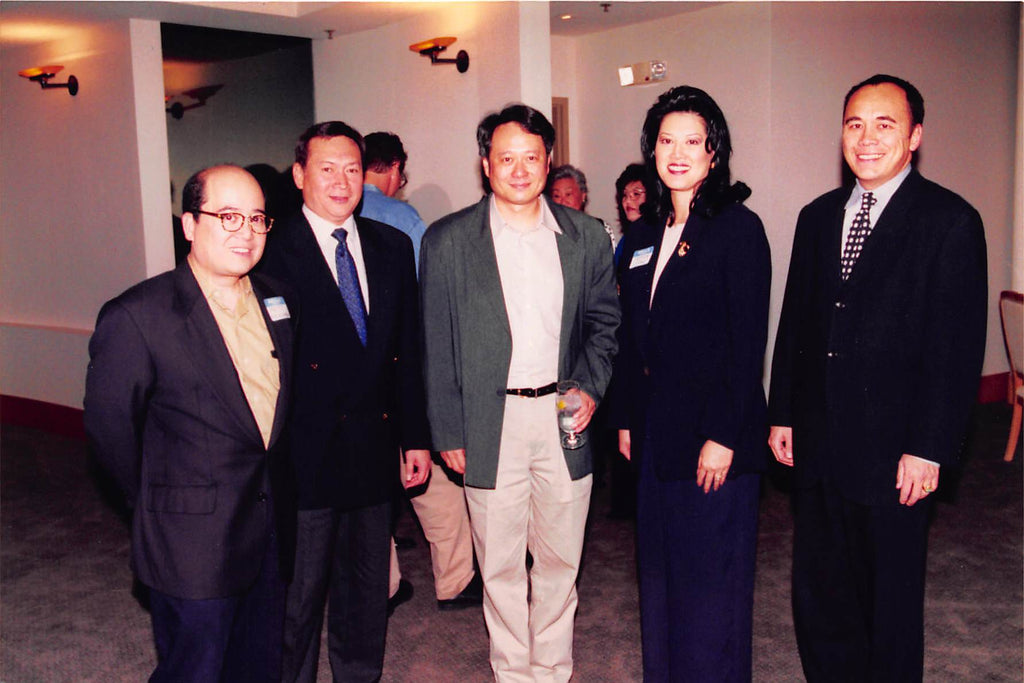 Photo from the 1990s of executives from CAPE, the nonprofit org, with Ang Lee, the famous movie director.