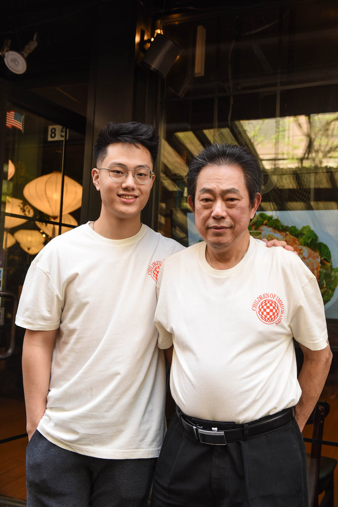 Father and son posing in our NY Forever x WE ARE CHIMMI collat t-shirt outside of their restaurant. 