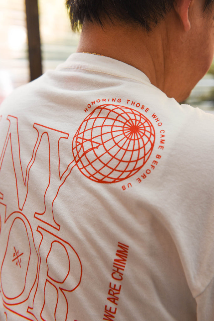 Shot of back graphic of our NY Forever x WE ARE CHIMMI t-shirt that reads "honoring those who came before us."