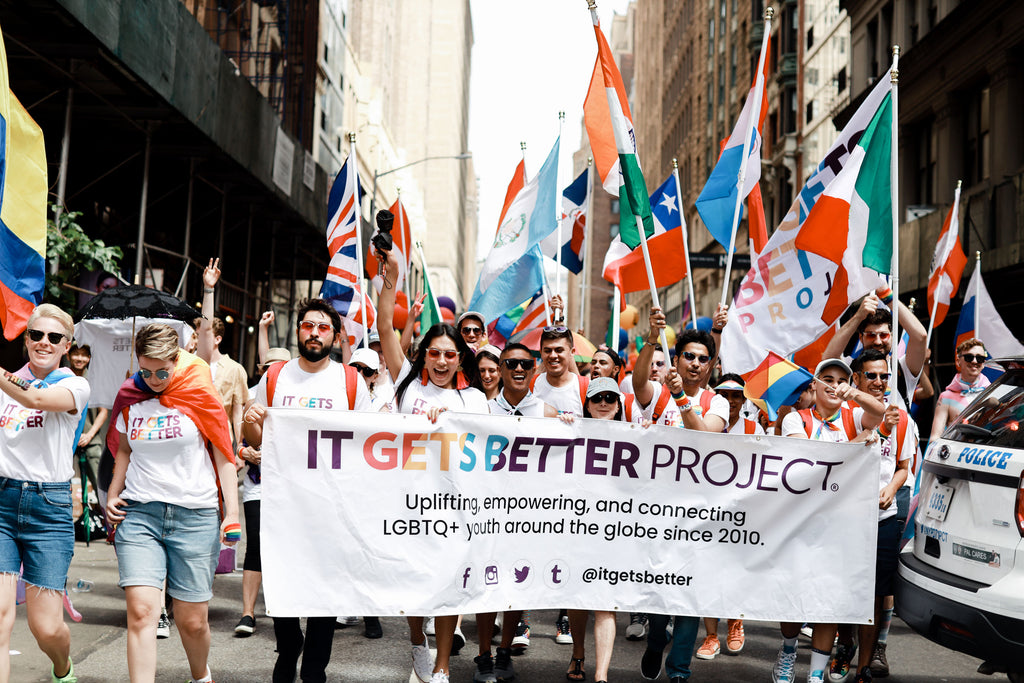 It Gets Better Project, a nonprofit that uplifts LGBTQ+ youth, marches in a parade.