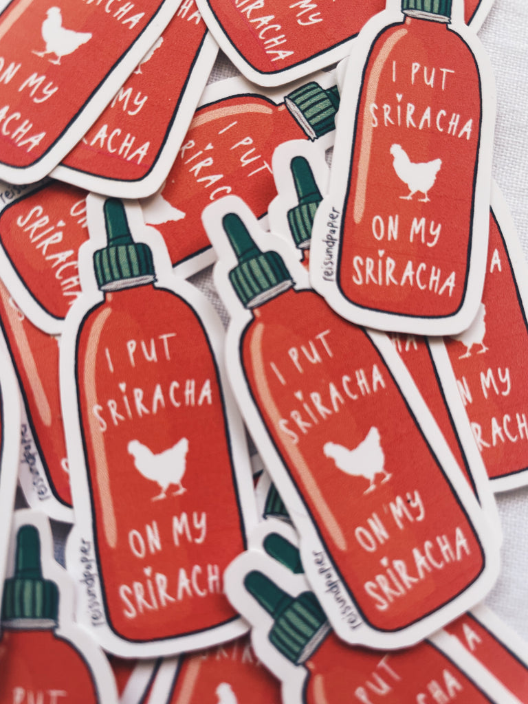 Sriracha bottle stickers that read "I put my Sriracha on my Sriracha" with a rooster outline on the bottle.