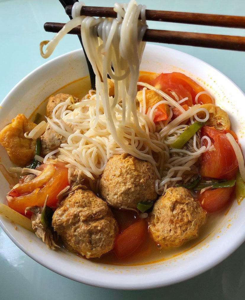 A bowl of bun rieu - a Vietnamese vermicilli rice noodle dish. 